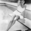 Annette-Funicello-16x20-Poster-in-swimsuit-posing-on-diving-board